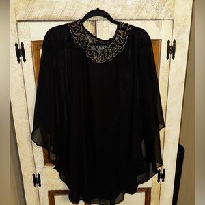 Women’s cocktail dress, caped